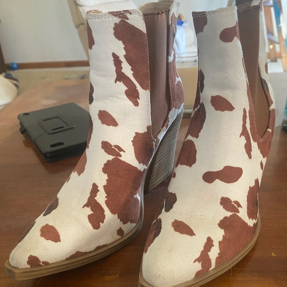 Cow print heeled booties
